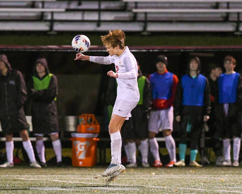 Benet Academy's Jackson Mares (12) heads the ball while taking on Prairie Ridge during the class 2A super sectional soccer match on Tuesday Nov. 5, 2024, held at Wheaton Academy in West Chicago.