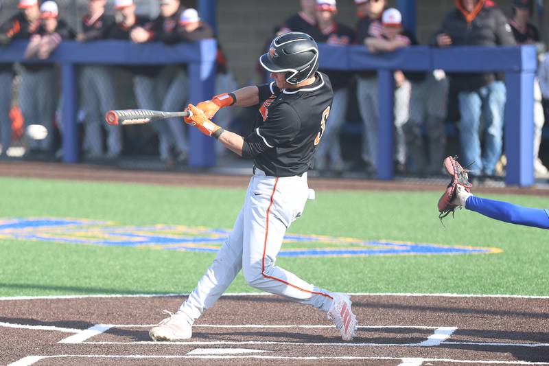 Minooka’s Gavin McReynolds connects against Joliet Central on Monday, April 6, 2026 in Joliet.