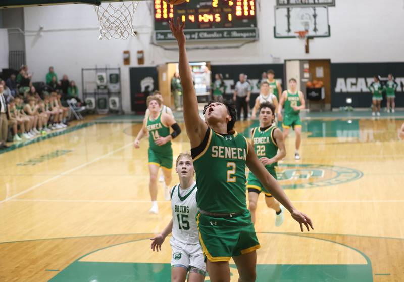 Seneca's Jesus Govea runs in on a break away to score over St. Bede's Geno Dinges on Tuesday, Dec. 16, 2025 at St. Bede Academy.