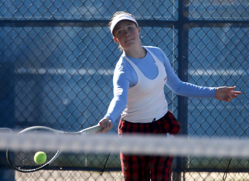 Marian Central’s Julia Lukey returns the ball Thursday, Oct. 23, 2025, during the first day of the IHSA State Girls Tennis Tournament at Schaumburg High School.