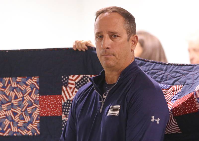 U.S. Navy Veteran Mark Mautino, of Spring Valley, receives his Quilt of Valor during the Tribute to Veterans on Wednesday, Aug. 20, 2025 at the Bureau County Fair in Princeton.
