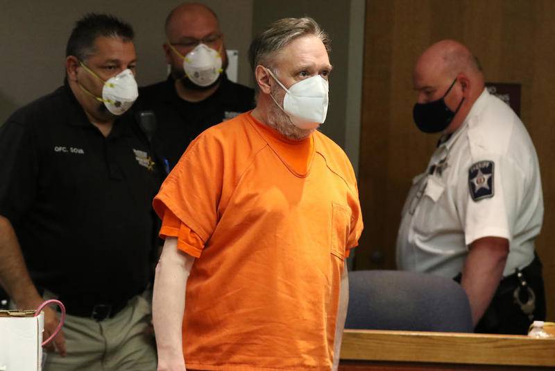 Andrew Freund is led into McHenry County Judge Robert Wilbrandt's courtroom at the Michael J. Sullivan Judicial Center, formerly known as the McHenry County Courthouse, after his sentencing hearing Friday in Woodstock.