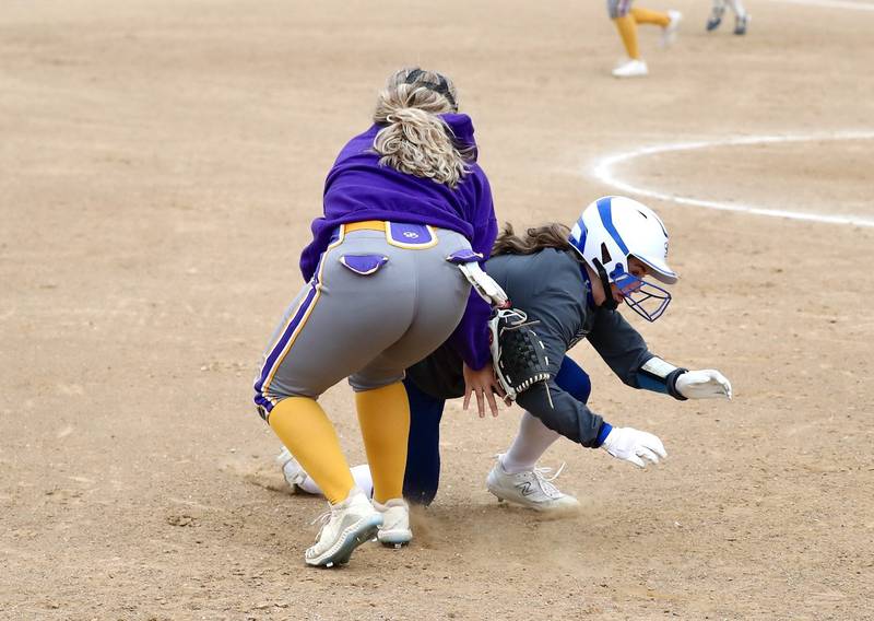 Mendota third baseman Ryleigh Sondgeroth tags out Princeton's Makayla Hecht Tuesday.