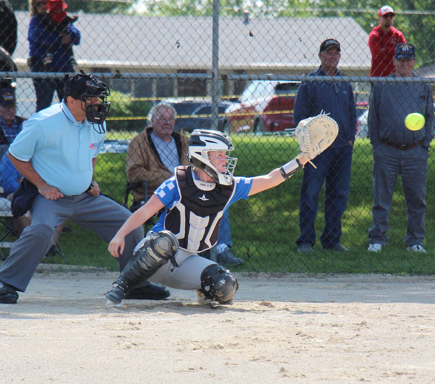 Newman senior catcher Carlin Brady reaches for a pitch Saturday during the Class 1A Newman Regional championship in Sterling.