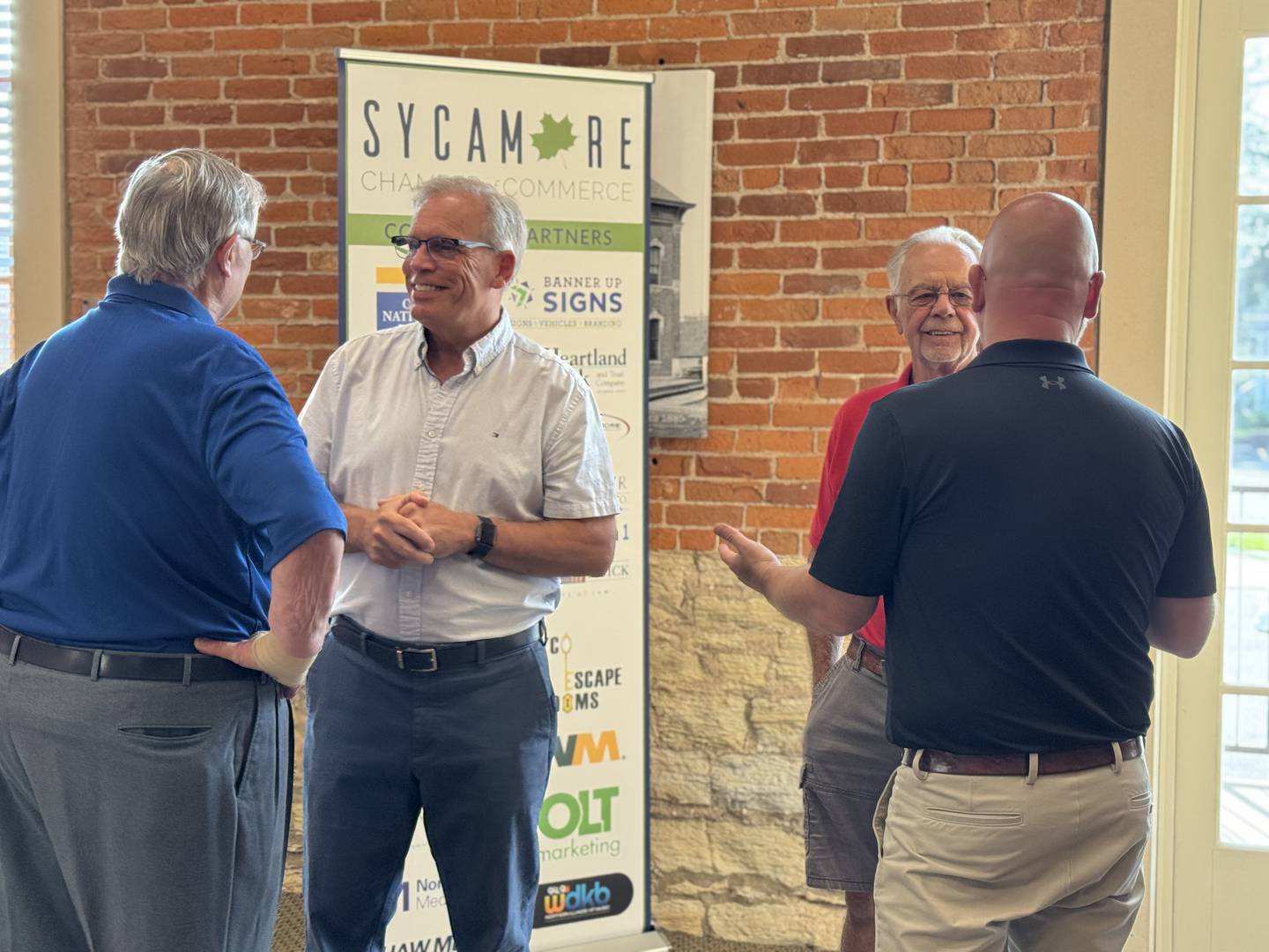 (From left) State Sen. Dave Syverson (R-Cherry Valley) and State Rep. Jeff Keicher (R-Sycamore) speaks with attendees at the Sycamore Chamber of Commerce's annual Legislative Briefing event on Wednesday, July 16, 2025.