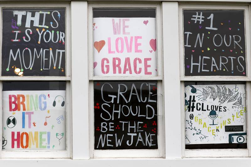 Signs in support of Grace Kinstler, a Crystal Lake Central High School graduate and finalist on "American Idol," are seen throughout downtown on Tuesday, May 18, 2021, in Crystal Lake.