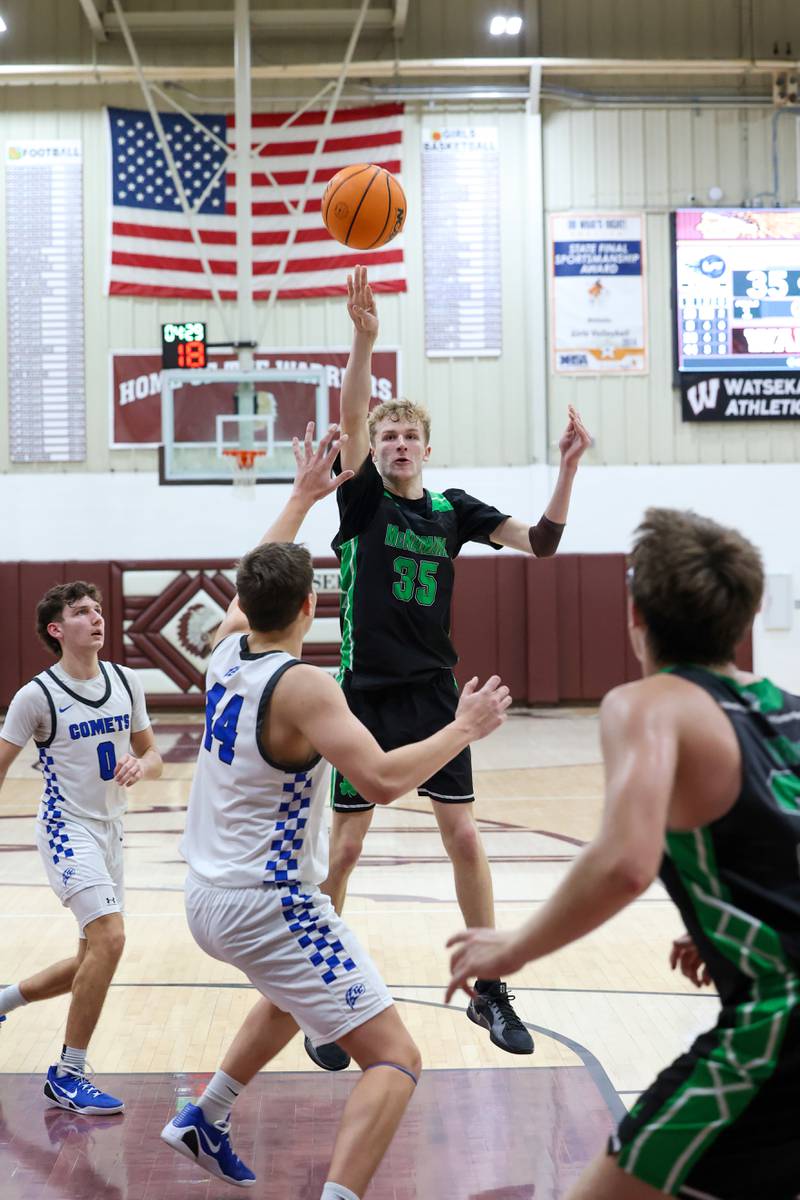 Bishop McNamara's Richie Darr tosses a pass over Clifton Central players to teammate Callaghan O'Connor during the Fightin' Irish's 62-41 victory in the Watseka Holiday Tournament championship on Tuesday, Dec. 16, 2025.