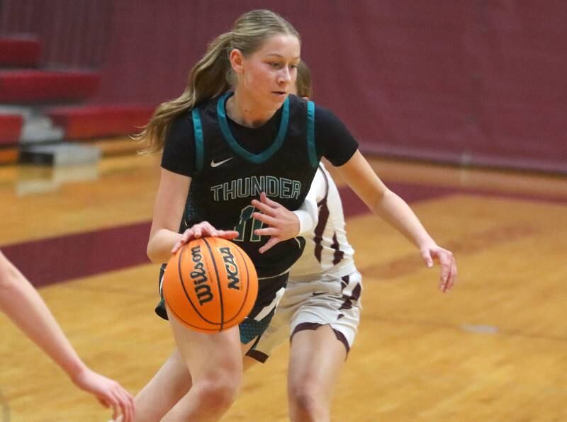 Woodstock North’s Abigail Ward moves with the ball in varsity girls basketball on Tuesday, Dec. 2, 2025, at Marengo High School in Marengo.