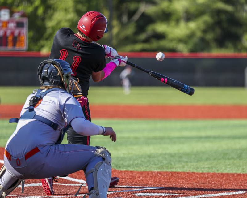 Yorkville's Bodhi Harrison (11) connects on a pitch during baseball game between Oswego at Yorkville. Thursday, May 8, 2025 in Yorkville.