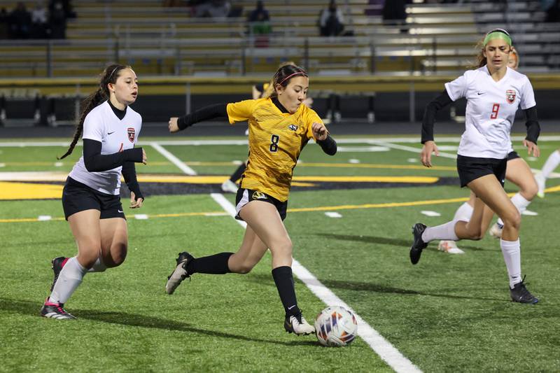 Herscher's Gianni Jaime advances the ball past Bradley-Bourbonnais defenders during the Tigers' 3-2 victory over Bradley-Bourbonnais on Tuesday, April 15, 2025.