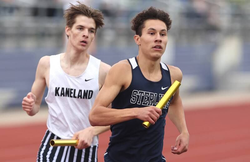 Sterling's Thomas Holcomb leads Kaneland's Trevor Neal during the second leg of the 4x800 meter relay Wednesday, May 18, 2022, at the Class 2A boys track sectional at Rochelle High School.