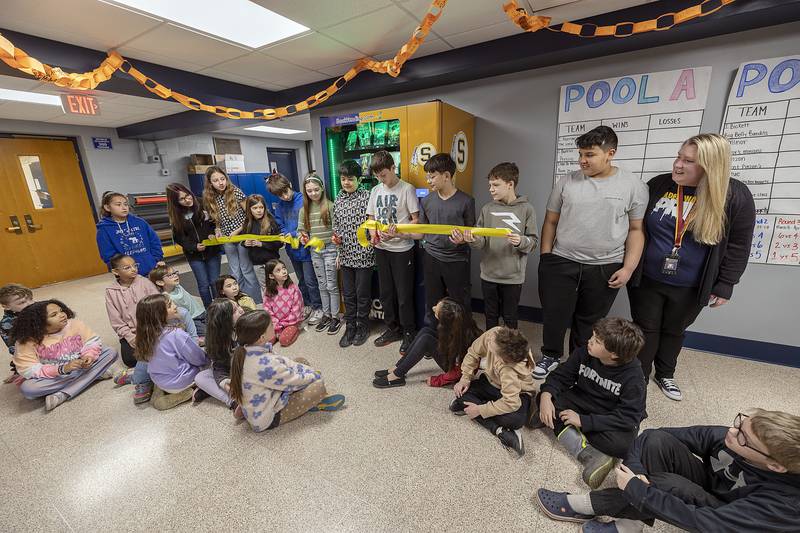 Lincoln students cut the ribbon to dedicate the new book vending machine Tuesday, March 25, 2025, in Sterling.