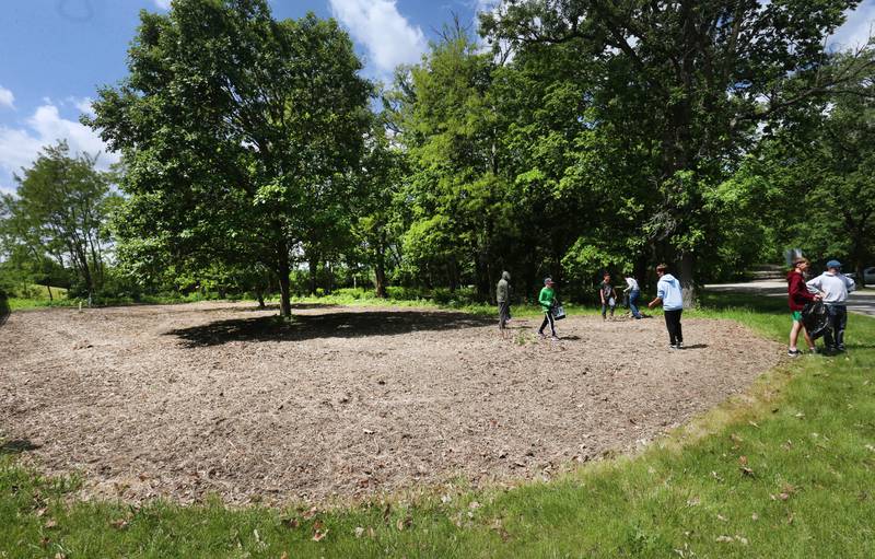 Milton Pope students spread pollinator seed on Friday, May 23, 2025 near entrance to Illini State Park in Marseilles. Milton Pope students volunteered their time planting seed, pulling up rocks, spreading mulch and helping with other tasks.