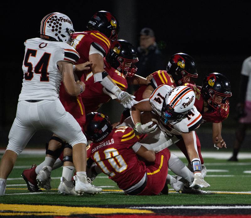 A pack of St. Anne players brings down South Fork's Ian Dial in a game on Friday, September 26, 2025.