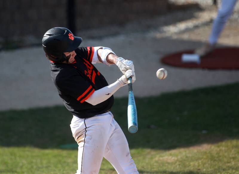 Wheaton Warrenville South's Nico Olszewski makes contact during a game against Geneva on Monday April 14, 2025 in Wheaton.