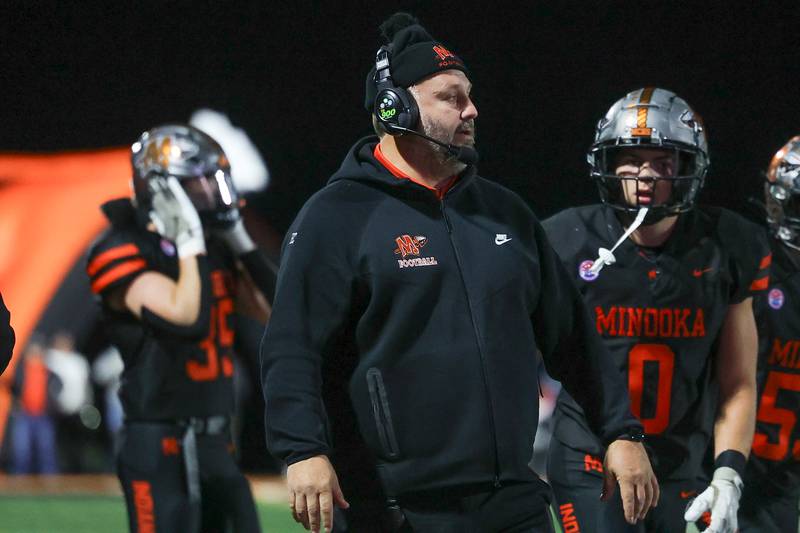 Minooka head coach Matthew Harding walks the sidelines during the game against Lincoln-Way East on Friday, Nov. 8, 2024 in Minooka.