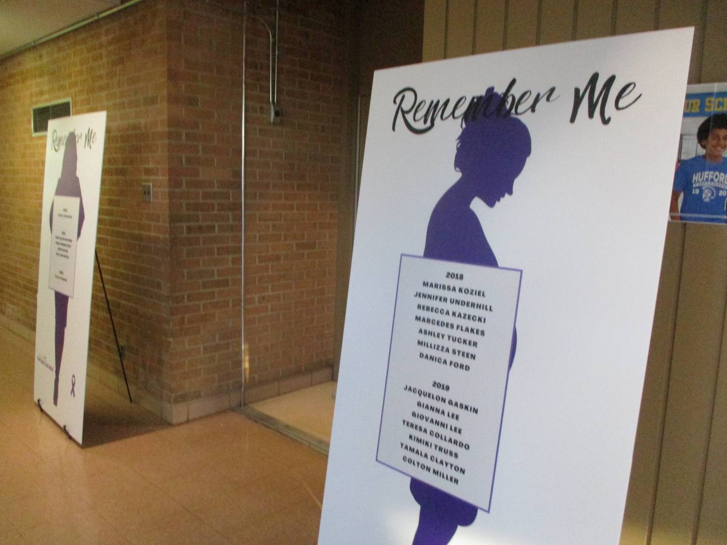 A sign at Take Back the Night at Hufford Junior High School in Joliet on Thursday lists women and children who were victims of domestic violence in Will County. Oct. 20, 2022.