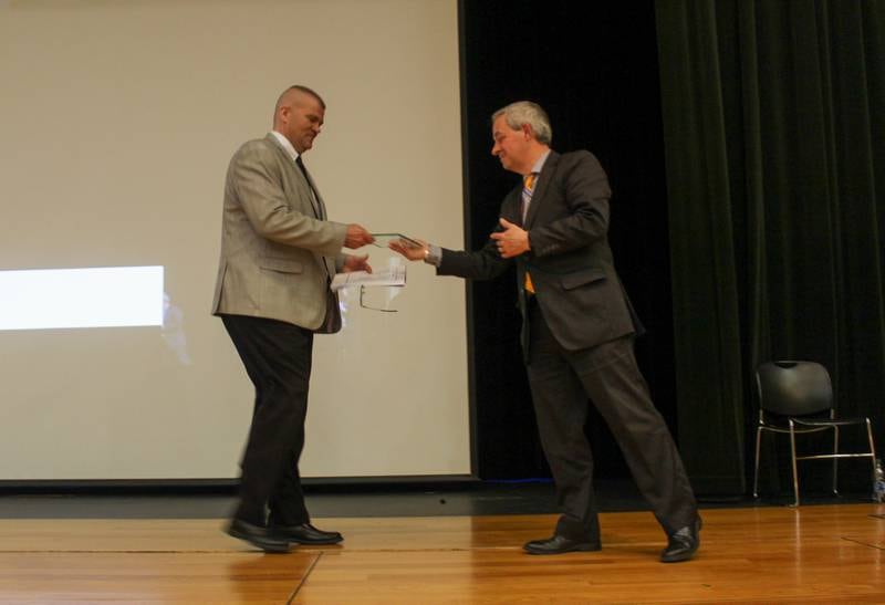District 202 Director of Community Relations Tom Hernandez (right) presents the 2021-22 CAPE Award to Lane Abrell,  retiring superintendent of schools, at CAPE's 46th annual awards night on Wednesday, April 20, 2022.