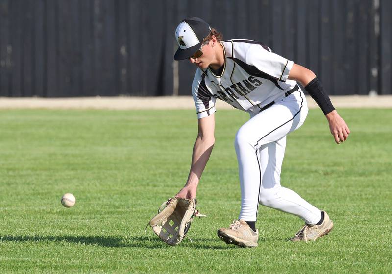 Sycamore's Ryker Rissman fields a ball in the outfield Tuesday, April 28, 2026, during their game against Kaneland at the Sycamore Community Sports Complex.