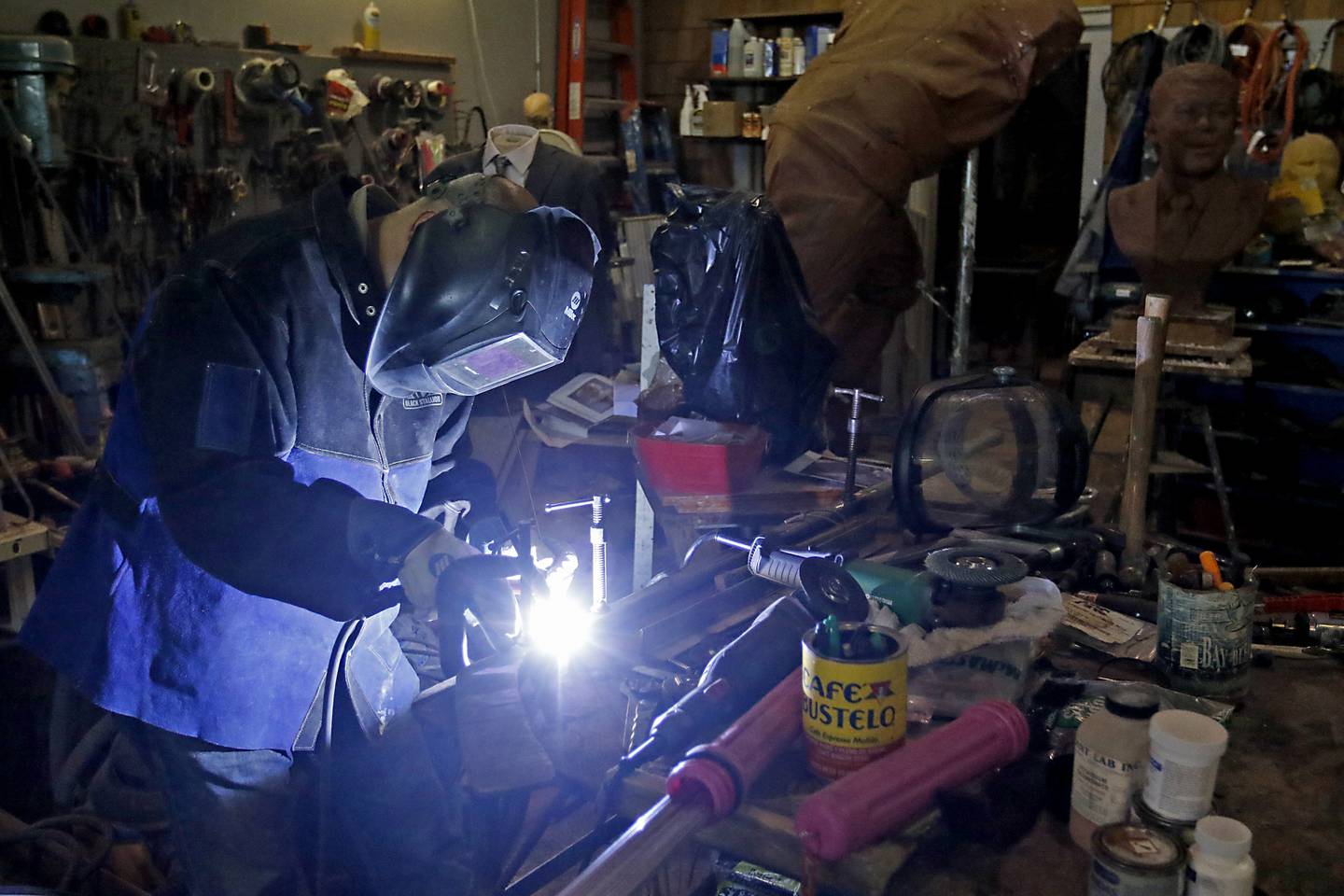 Erik Blome works on a sculpture in his studio in Woodstock on  Dec. 27, 2022.