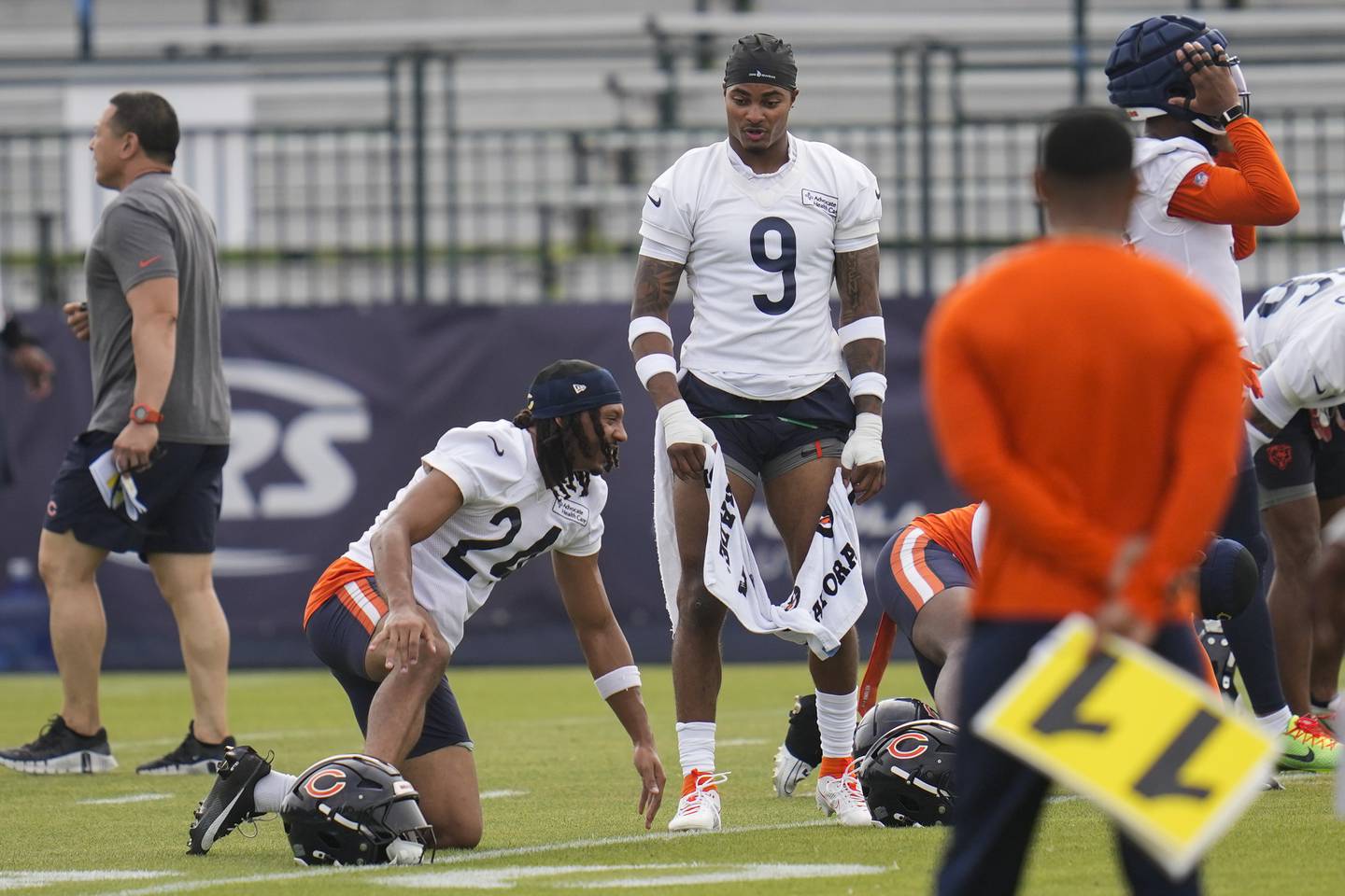 Chicago Bears safety Jaquan Brisker (9), right and cornerback Nick McCloud (24) work out during practice at the team’s NFL football training camp, Thursday, July 24, 2025, in Lake Forest, Ill. (AP Photo/Erin Hooley)