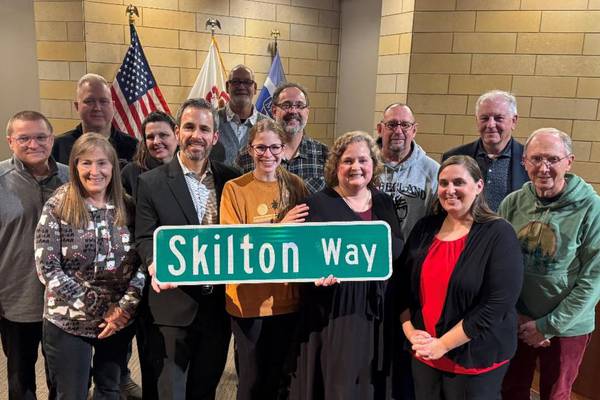 Montgomery dedicates ceremonial street sign to retired Oswego library director