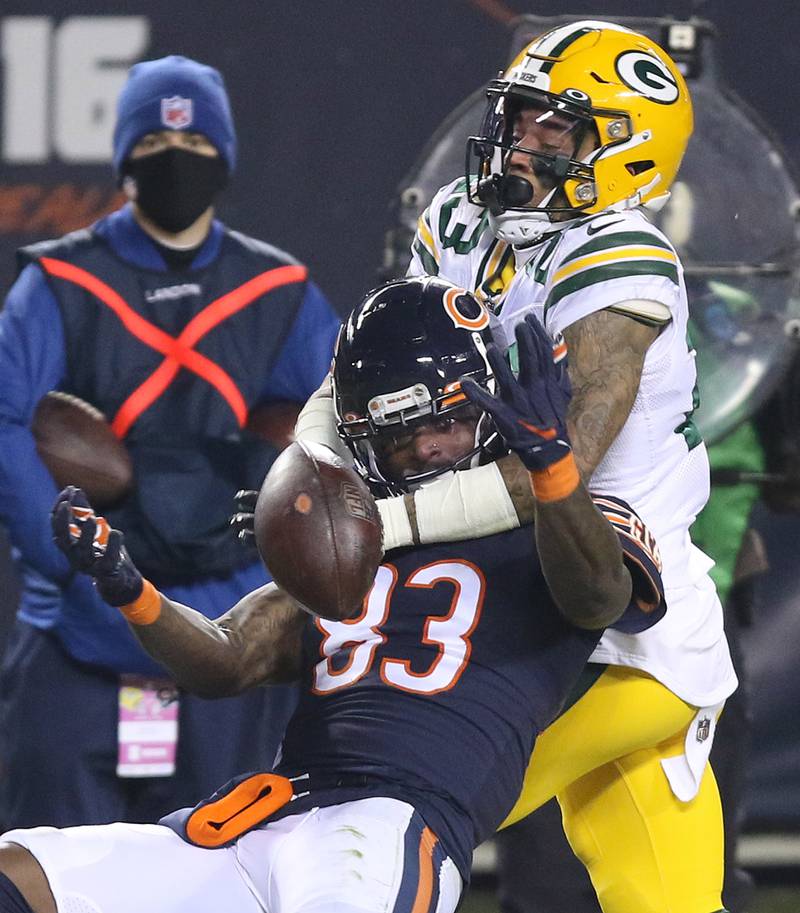 Green Bay Packers cornerback Jaire Alexander (23) breaks up a pass intended for Chicago Bears wide receiver Javon Wims (83) during their game Sunday at Soldier Field in Chicago.