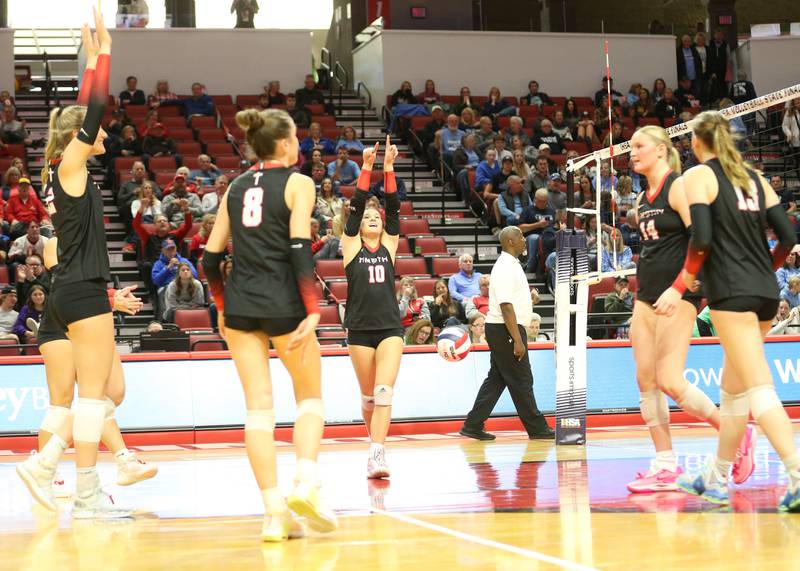 Members of the Timothy Christian volleyball team react after scoring a point against Bloomington Central Catholic during the Class 2A State semifinal game on Friday, Nov. 15, 2024 at CEFCU Arena in Normal.