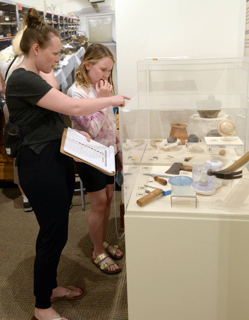 Kim (left) and Maddie Ludwig of Elmhurst work on matching artifacts at the Elmhurst Historical Museum during Museum Day held Sunday, May 15, 2022.