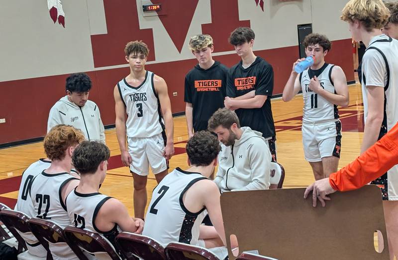 Crystal Lake Central boys basketball coach Dan Oziminski talks to his team during a timeout Saturday, Dec. 28, 2024, against Woodstock North at the E.C. Nichols Holiday Classic in Marengo.