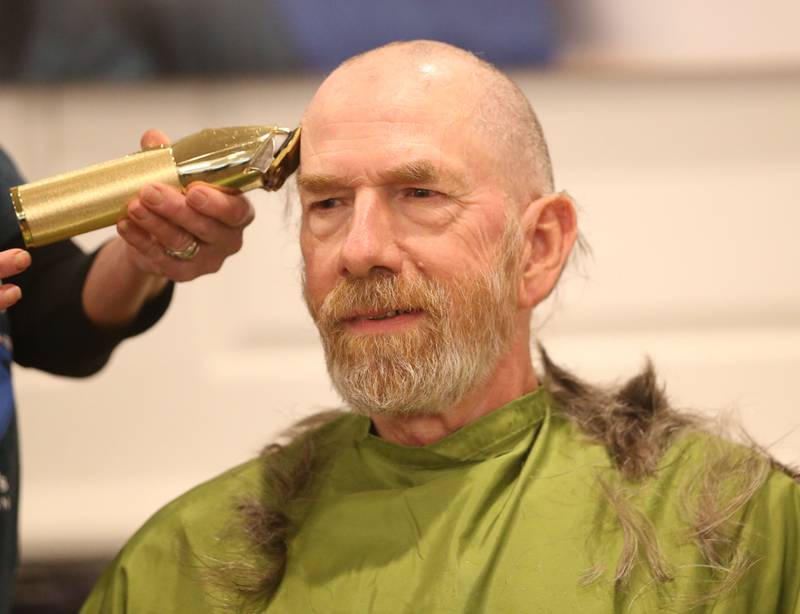 Bruce Brown has his head shaved during the 18th annual Illinois Valley Emergency Services St. Baldrick's event on Sunday, March 23, 2025 at Senicas Oak Ridge in La Salle.