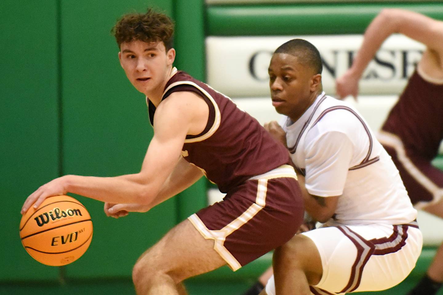 Morris' Brycen Johnson, left, is defended by Kankakee's Myair Thompson during the IHSA Class 3A Geneseo Regional semifinal Wednesday, Feb. 25, 2026.