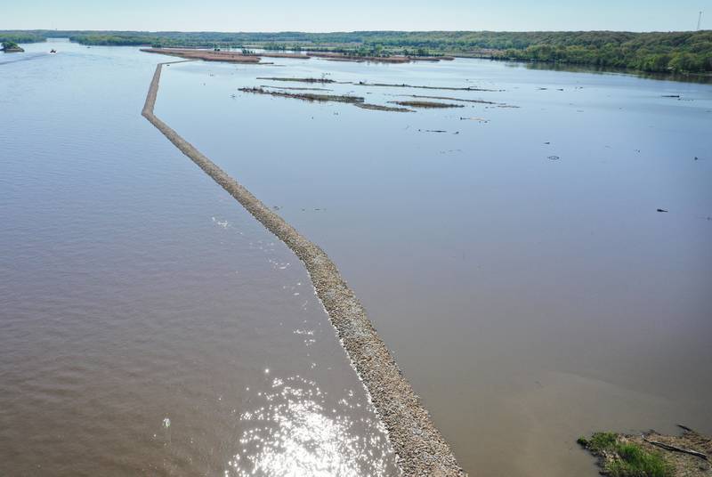 An aerial view of the breakwater wall near Delbridge Island just east of the Starved Rock Lock and Dam on Tuesday, April 30, 2024 near Starved Rock State Park. The Starved Rock Breakwater project is nearing compleation. The project is a habitat restoration effort designed to restore submerged aquatic vegetation in the Illinois River, Starved Rock Pool. It will increase the amount and quality of resting and feeding habitat for migratory waterfowl and improve spawning and nursery habitat for native fish.The breakwater structure will be approximately 6,100 feet long and constructed to a design elevation 461.85 feet, providing adequate protection to allow for submerged aquatic vegetation growth. The estimated total cost of this project is between $5 and $10 million.