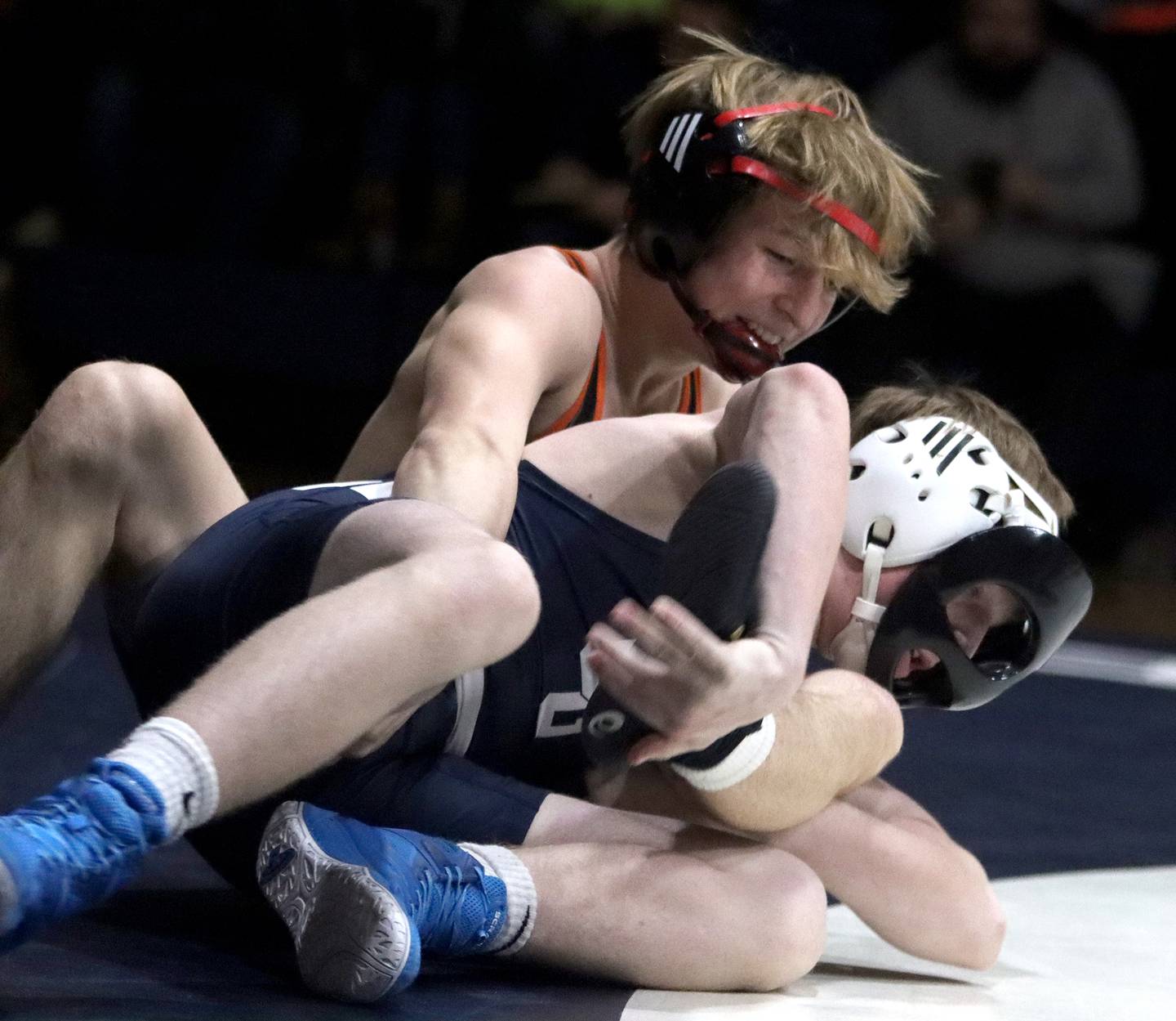 Crystal Lake Central’s Dylan Ramsey, top, battles Cary-Grove’s Joe Rohrbach at 126 pounds in varsity wrestling Thursday, Dec. 19, 2024 at Cary-Grove High School in Cary.
