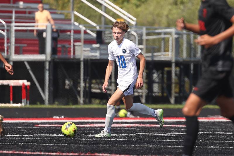 Lincoln-Way East’s Brian McCracken looks for a play against Bolingbrook on Saturday, Sept. 30, 2023 in Bolingbrook.