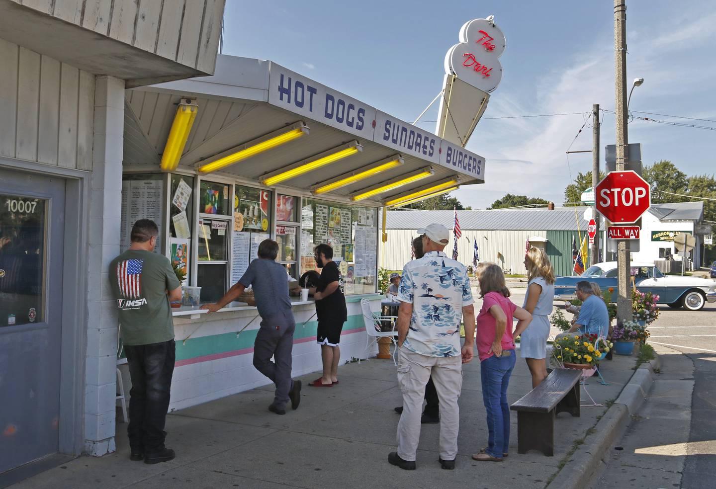 People line up outside the Dari in Hebron Sunday, Sept. 18, 2022, to get food and ice cream. The Hebron landmark, that has been in operation for 53 years, is closing and up for sale. Sunday was their last day of operation.