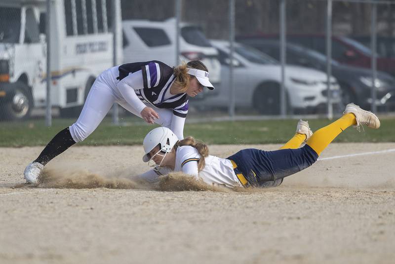 Dixon’s Abby Hicks tags out Sterling’s Mya Lira at third base Tuesday, March 24, 2026.