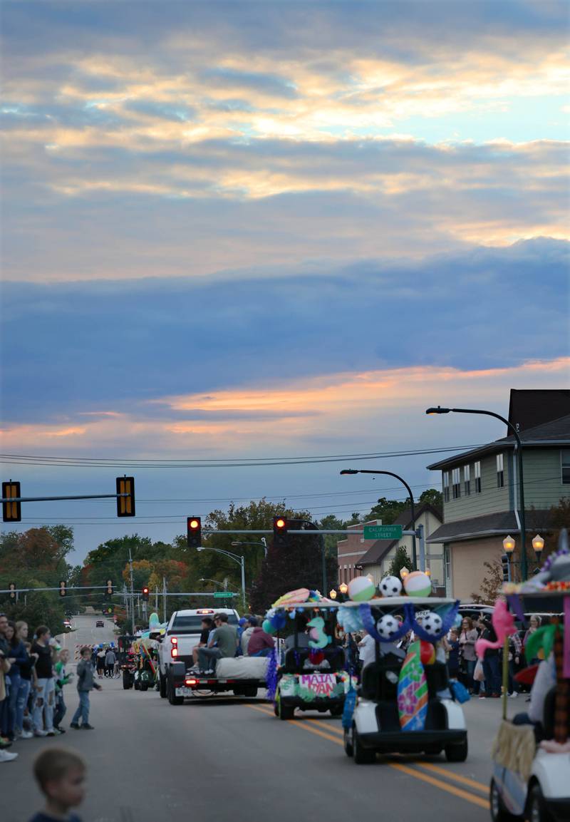 The Sycamore High School homecoming parade heads off into the sunset Wednesday, Oct. 5, 2022, in downtown Sycamore.