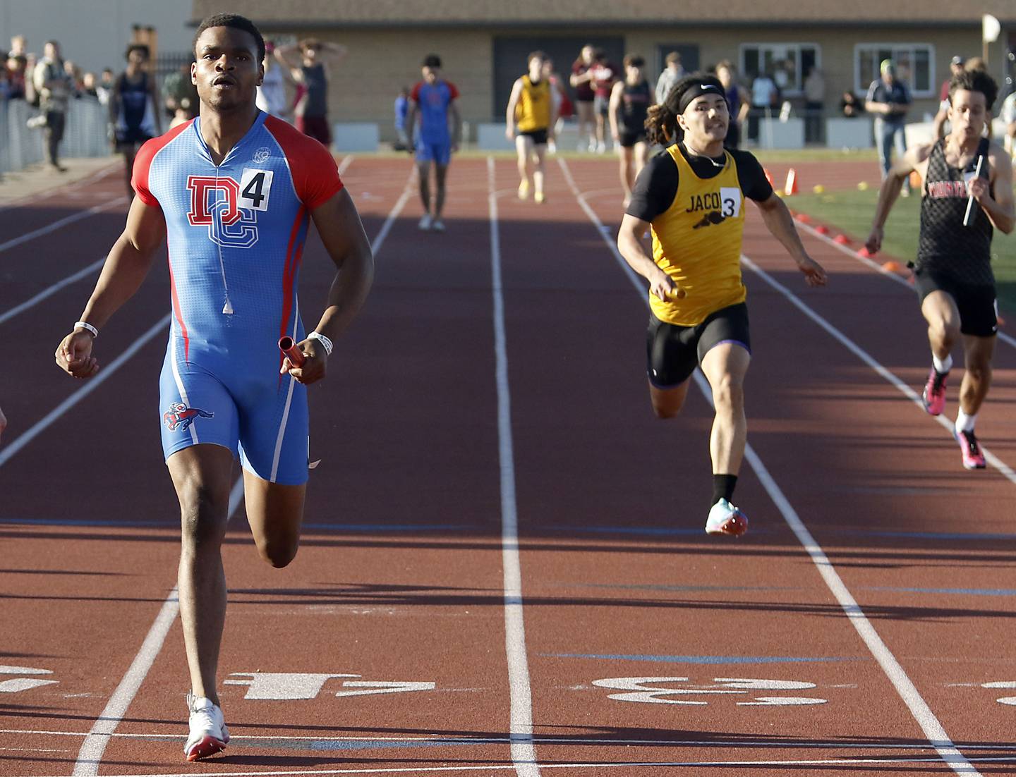 Dundee-Crown's Oreoluwa Sobodu crosses the finish line as he runs the last leg of the 4x100 meter relay during the Fox Valley Conference  Boys Track and Field Meet on Thursday, May 14, 2026, at Huntley High School.