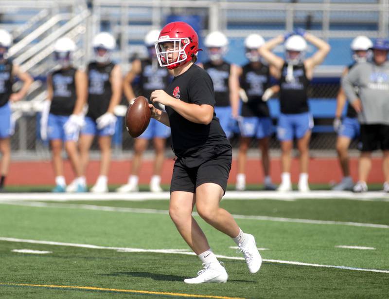 Yorkville quarterback Michael Dopart looks to pass the ball during a 7-on-7 football game against St. Charles North at St. Charles North on Thursday, June 22, 2023.