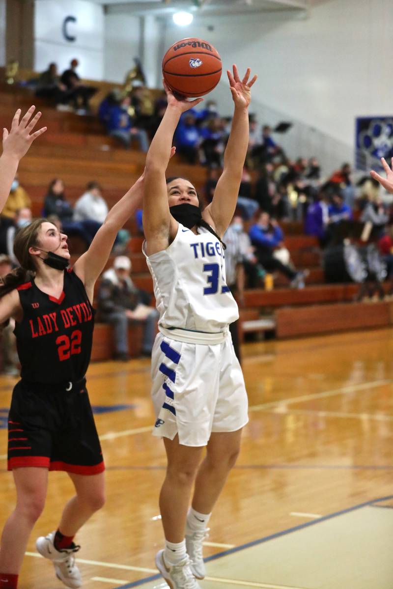 Princeton's Emma Kruse-Carter shoots in front of Hall's Kennedy Wozniak Monday night at Prouty Gym. The Tigresses rallied for a 40-32 victory.