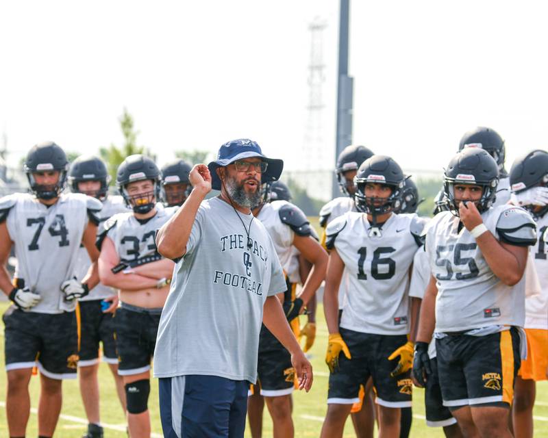 Oswego East Head Coach Tyson LeBlanc talks with Metea Valley before the start of practice and a recent 7 on 7 between Oswego East and Metea Valley on Thursday July 7th held at Metea Valley.