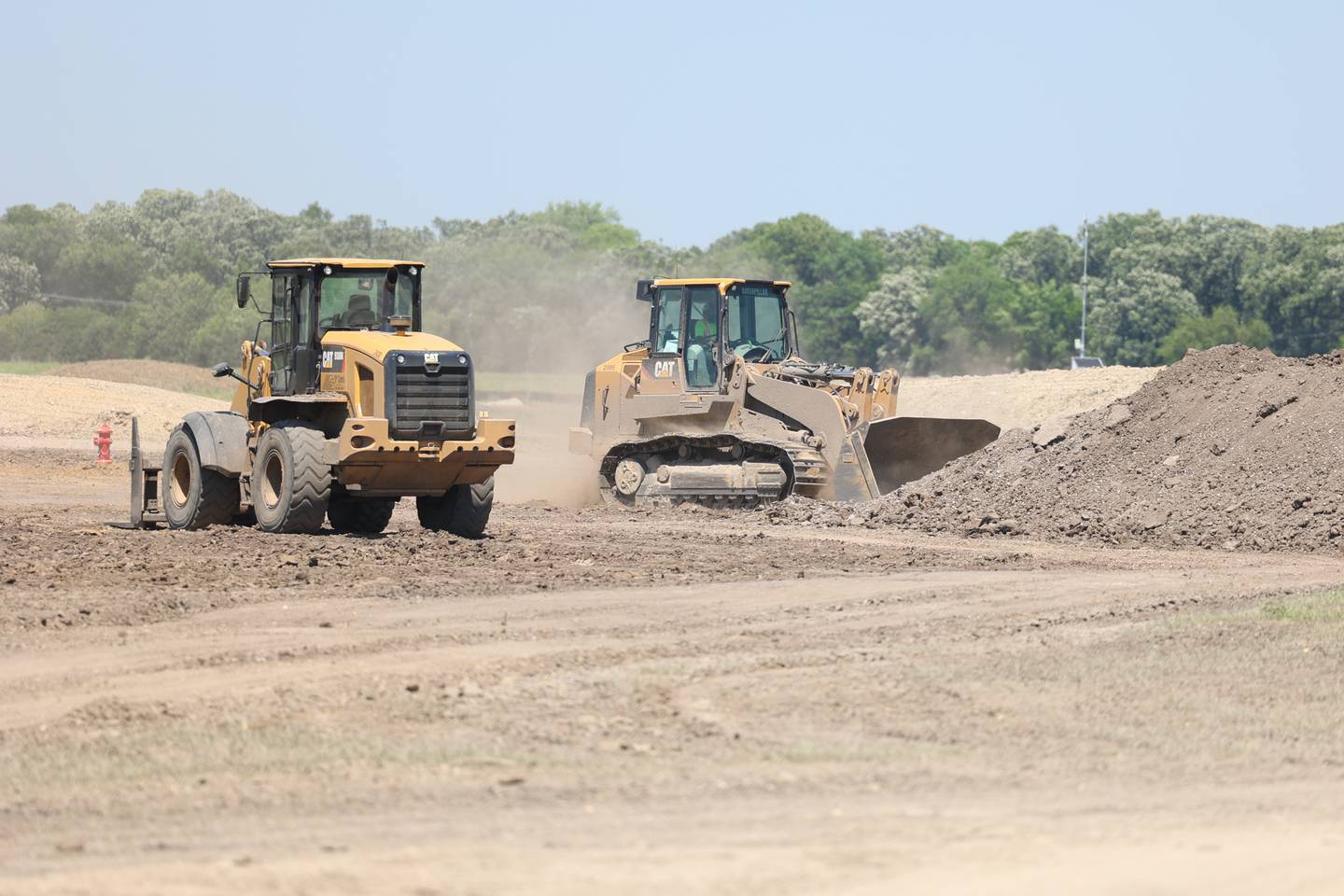 Land clearing equipment works on the site of the 310 acre Rock Run Crossing mix-use project near the intersection of I-55 and I-80. Tuesday, June 21, 2022 in Joliet.