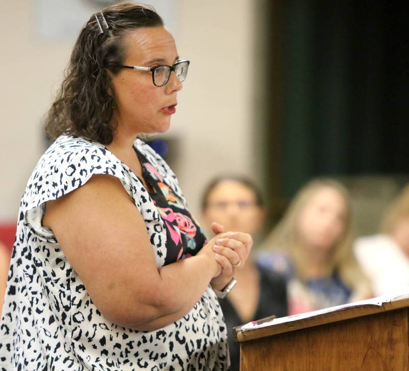 Elizabeth Lundeen, who has children in the Sycamore School District, addresses the board Tuesday during the District 427 School Board meeting at Sycamore High School. A group of parents were in attendance urging the board not to make mask wearing mandatory for students in the district.