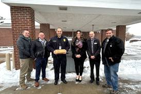 The First National Bank in Amboy donates card skimmer detection devices to Dixon Police Department