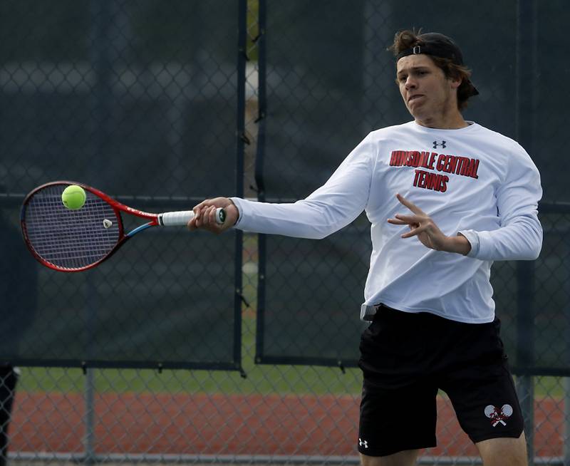 Hinsdale Central's Aidan Hernandez returns the ball during an IHSA 2A boys doubles tennis match Thursday, May 25, 2023, at Buffalo Grove High School.