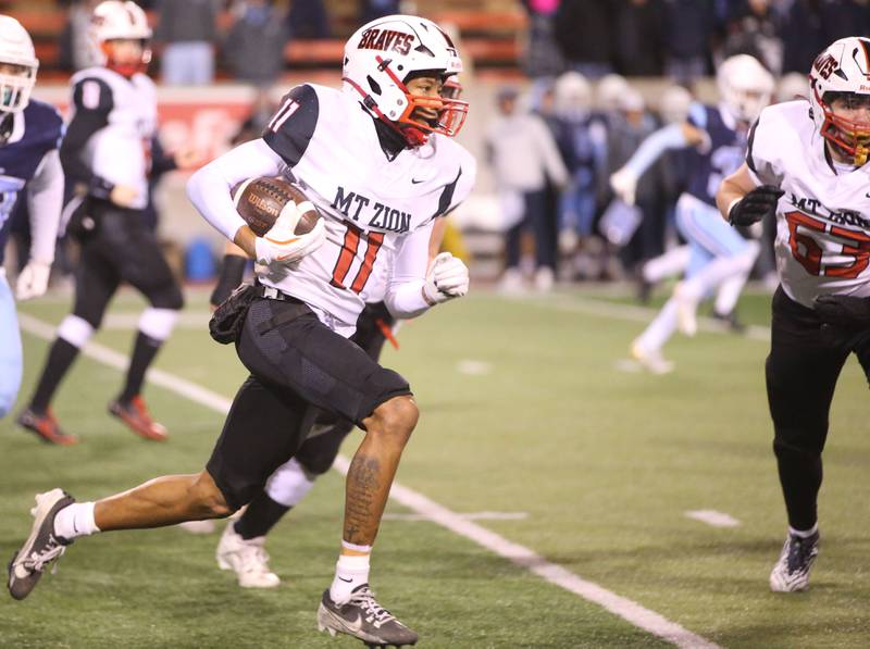 Mt. Zion's Brayden Trimbel runs with the ball against DePaul during the Class 4A State football championship on Friday, Nov. 29, 2024 at Hancock Stadium in Normal.