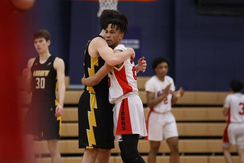 Andrew’s Michael Morawski congratulates Bolingbrook’s Daniel Walker as the time runs out in the Raiders win in the Class 4A Oswego Sectional semifinal. Wednesday, Mar. 2, 2022, in Oswego.