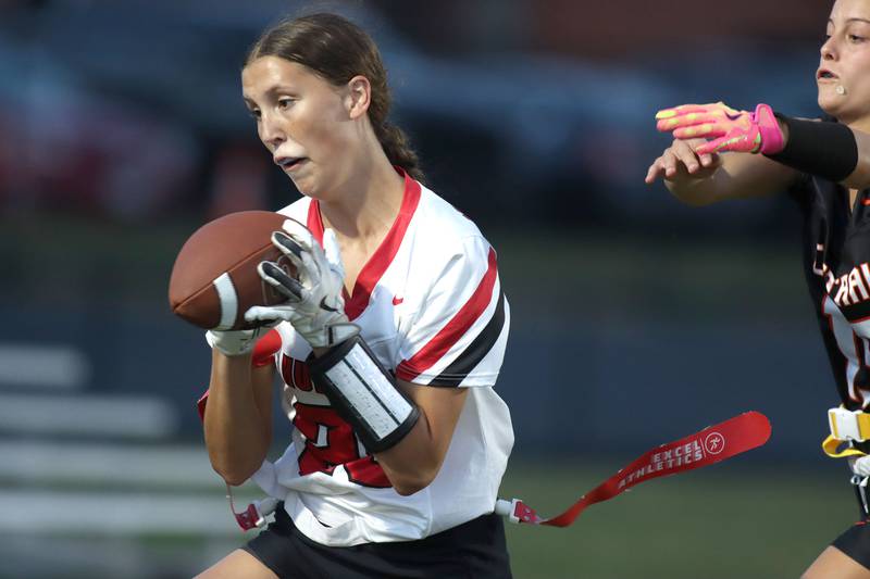 Huntley’s Evelyn Freundt reels in a touchdown reception in varsity flag football at Owen Metcalf Field on the campus of Crystal Lake Central High School in Crystal Lake on Tuesday, Sept. 16, 2025.