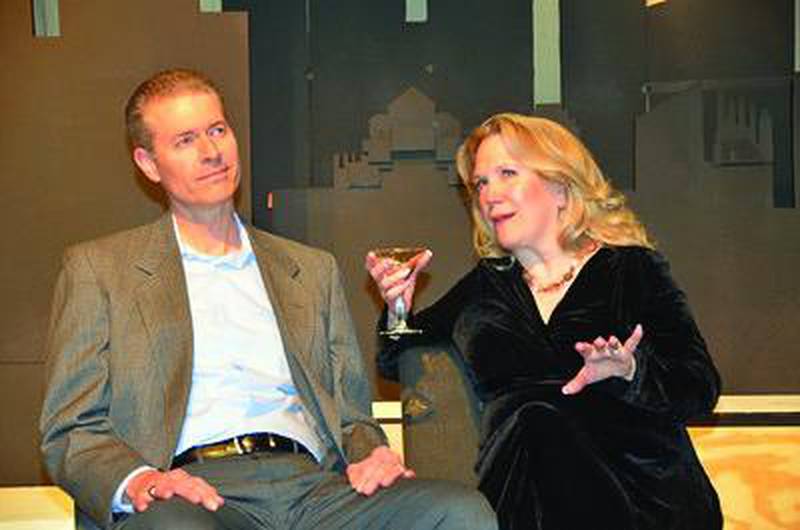 Bobby (Chris Engelhardt) contemplates relationships with Joanne (Jennifer Franco) in a scene from "Company," being staged by PM&L Theatre in Antioch.